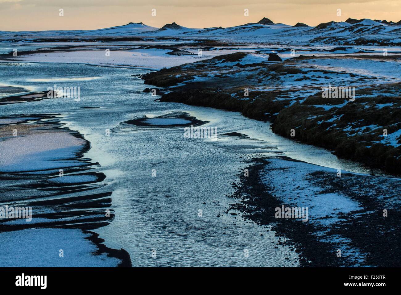 Iceland, South coast, Myrdalssandur, reflections on the water through the black sand plains Myrdalssandur, Sunrise Stock Photo