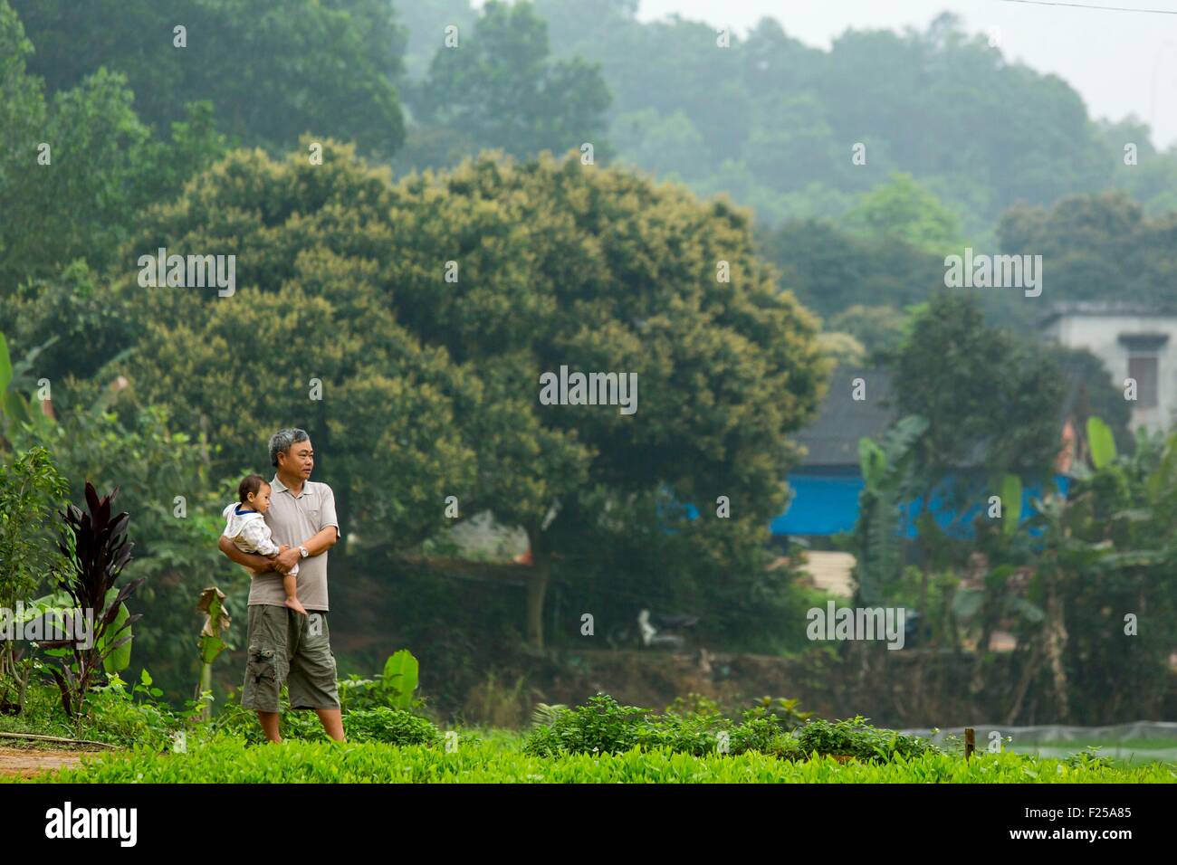 Vietnam, Phu Tho province, Doan Hung, Ngoc Quan, man and child Stock Photo