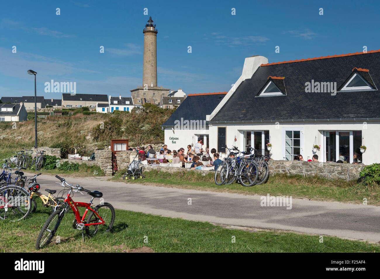 France, Finistere, Ile de Batz, creperie and lighthouse Stock Photo