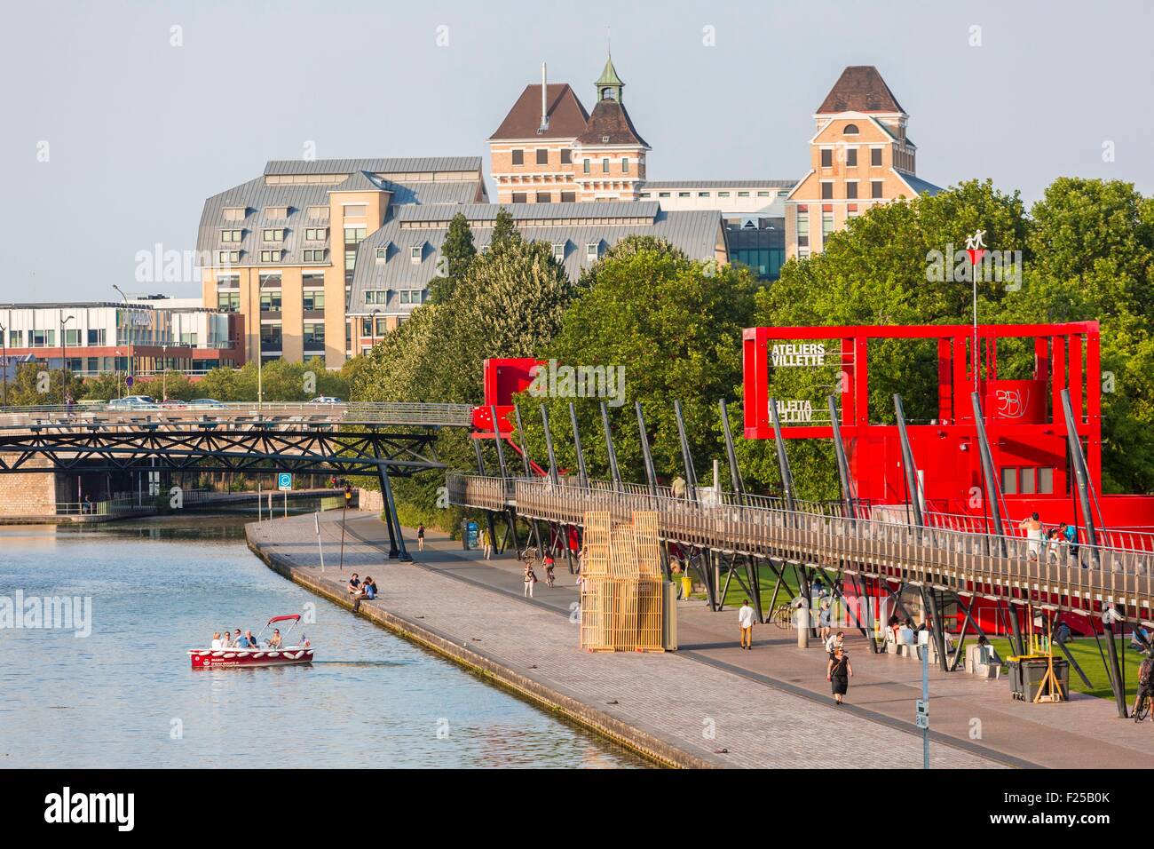 France, Paris, the Parc de la Villette, designed by architect Bernard Tschumi in 1983, the Ourcq canal, red buildings called Folies Stock Photo