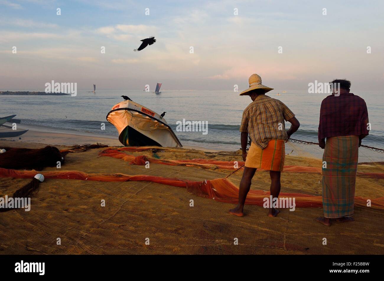 Sri Lanka, Western Province, Negombo, fishermen sorting their nets on the Porathota beach Stock Photo