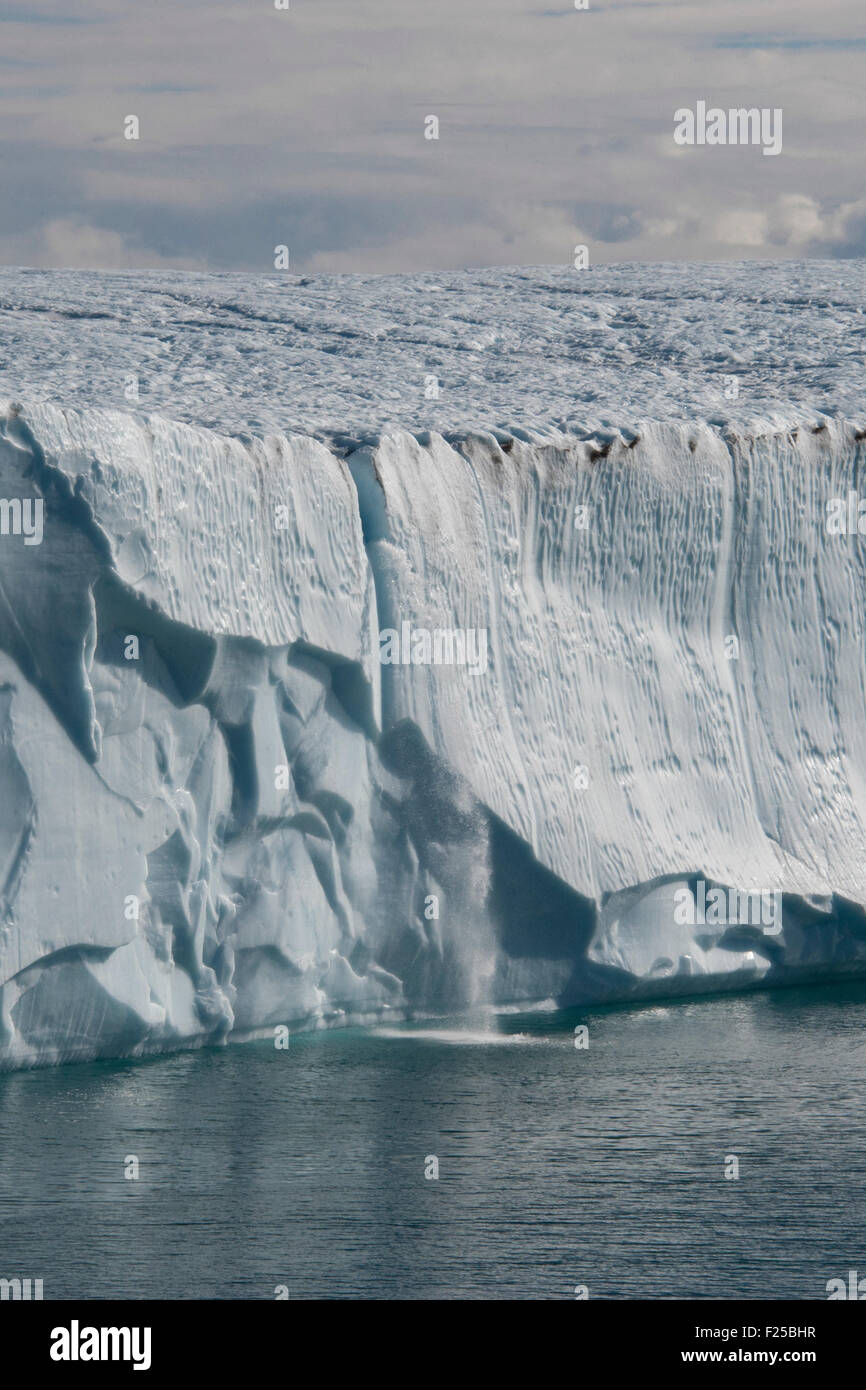 Waterfall on iceberg near Baffin Island, Canadian Arctic Stock Photo