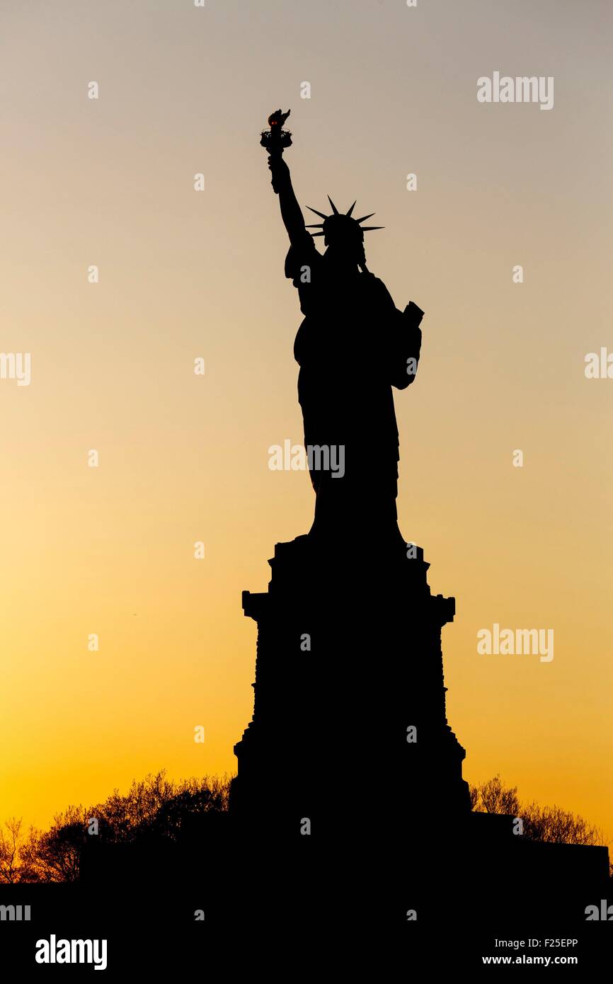 United States, New York, the Statue of Liberty at sunset Stock Photo