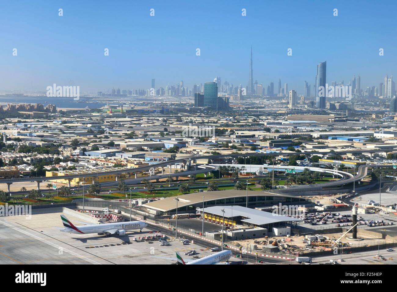 United Arab Emirates, Dubai, Dubai International Airport and the city center in the background (aerial view) Stock Photo