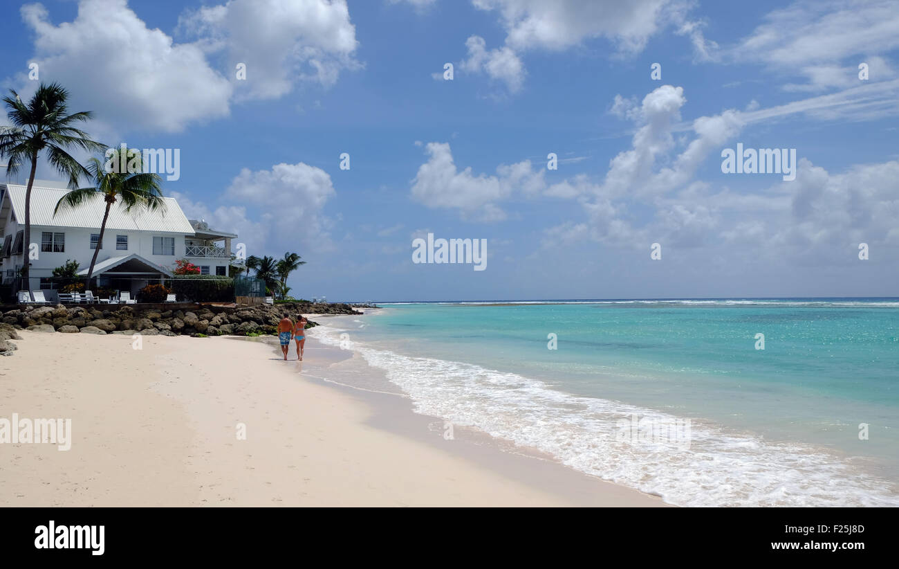 Worthing Beach Barbados with walkers Stock Photo