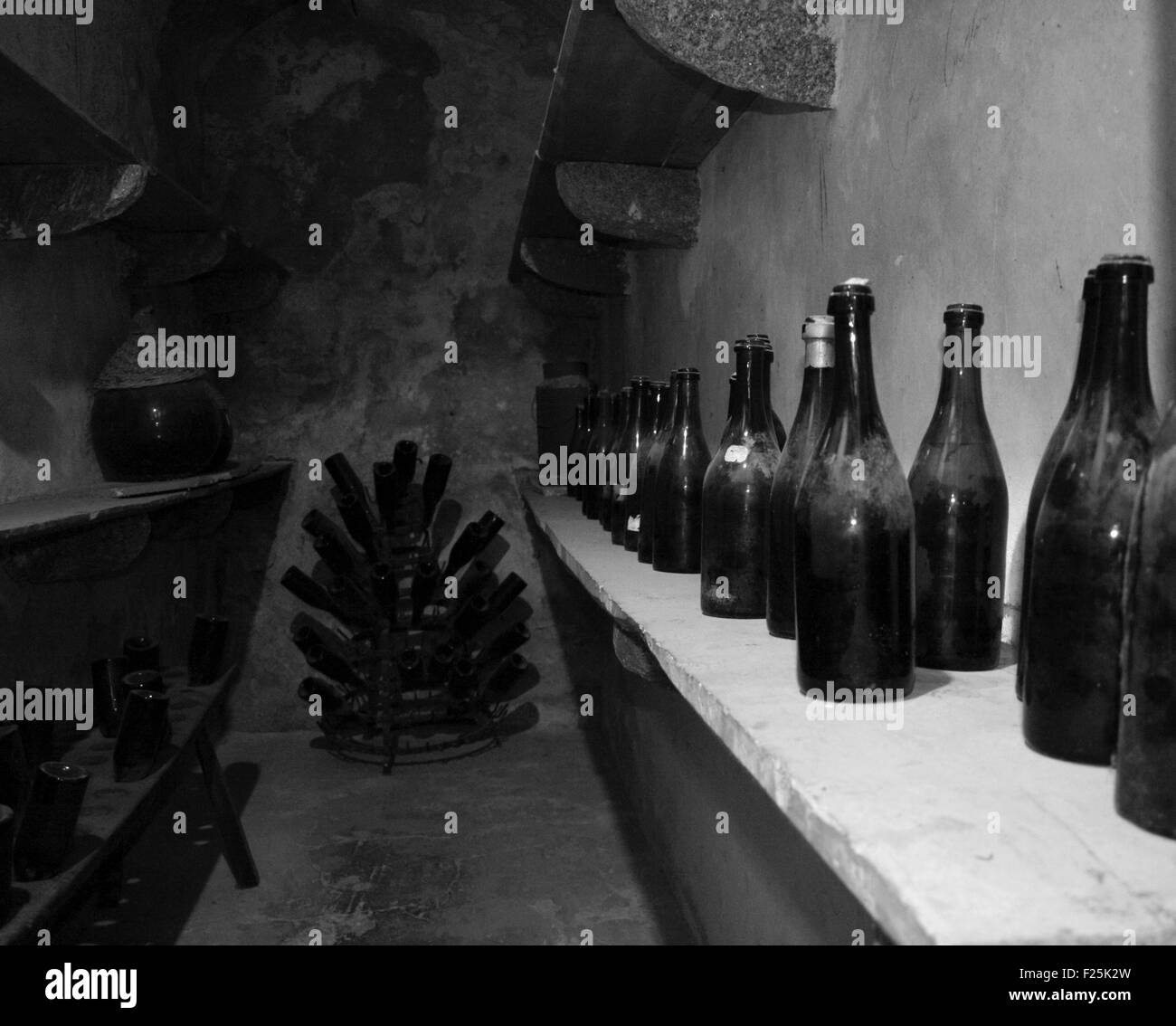 Wine Bottles in the cellar Stock Photo