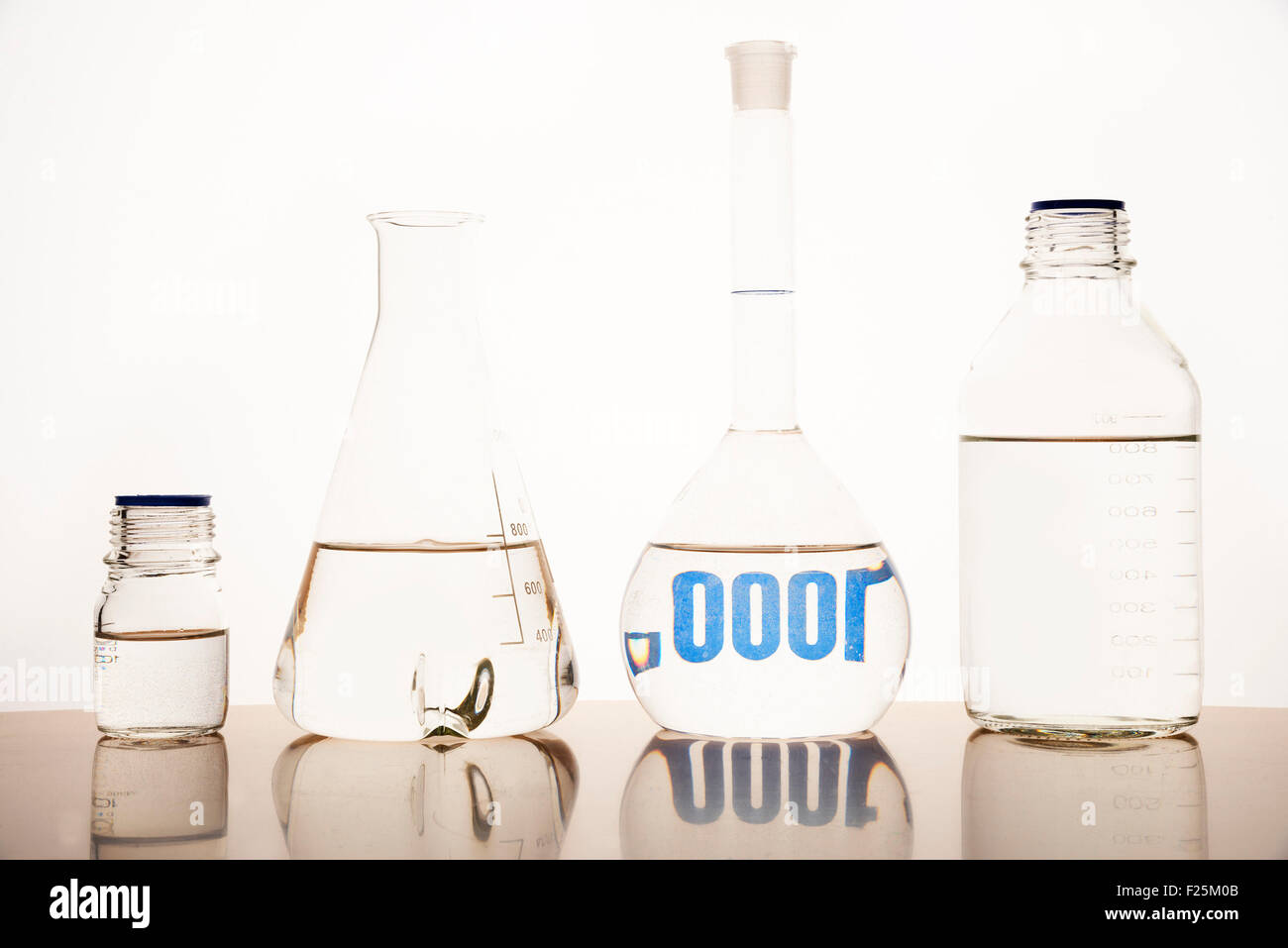 Measuring glasses on a table of a chemical laboratory Stock Photo