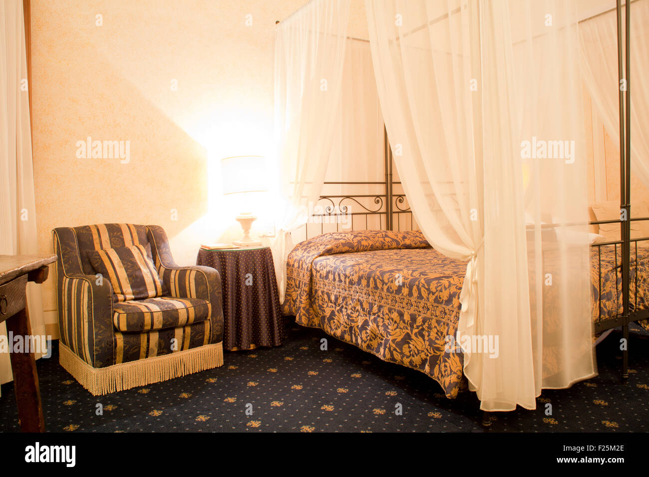 Sofa and bed in an albergue room Stock Photo