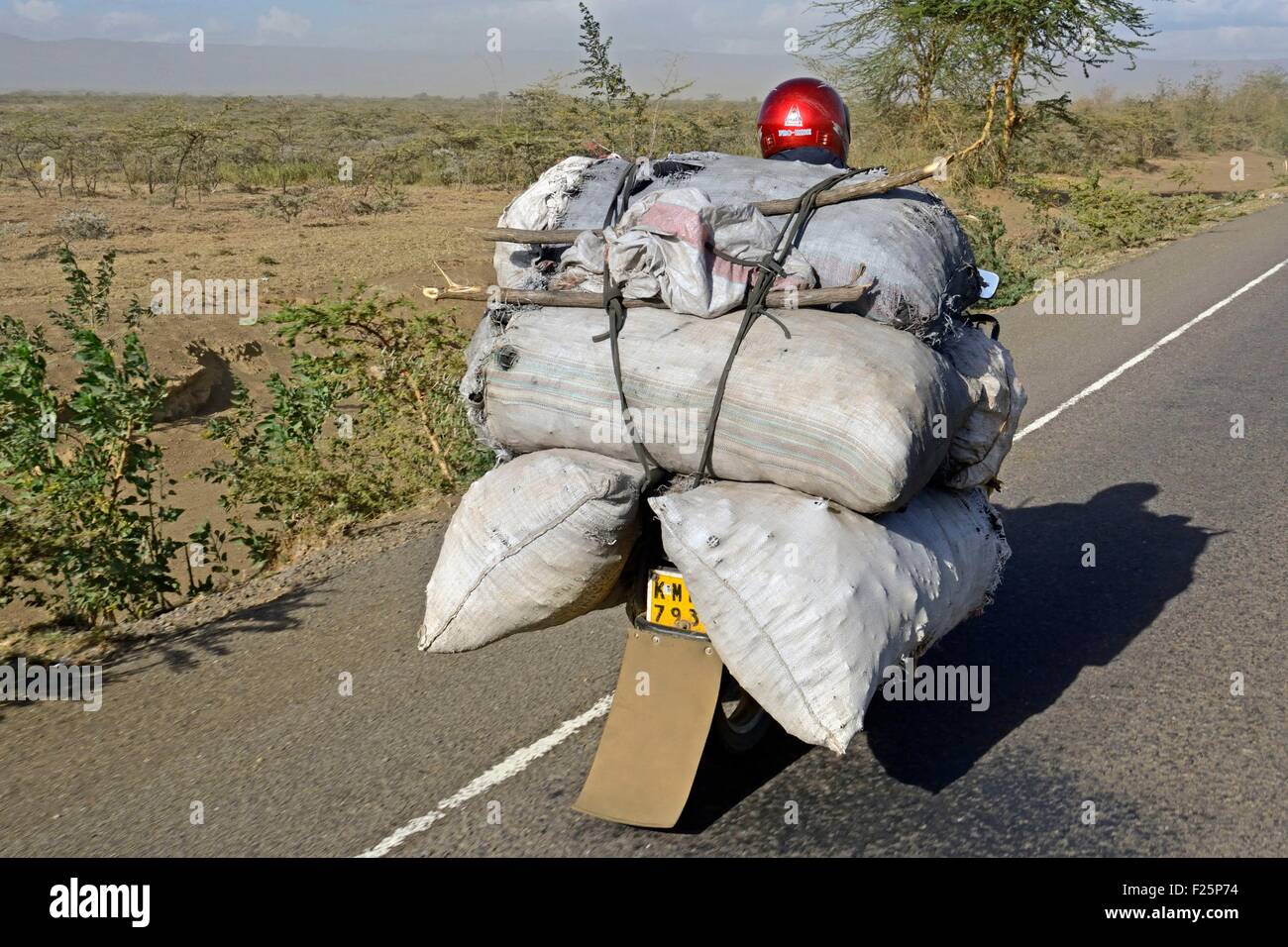 Kenya, Nairobi, loading and transportation of bulky motorcycle bags Stock Photo