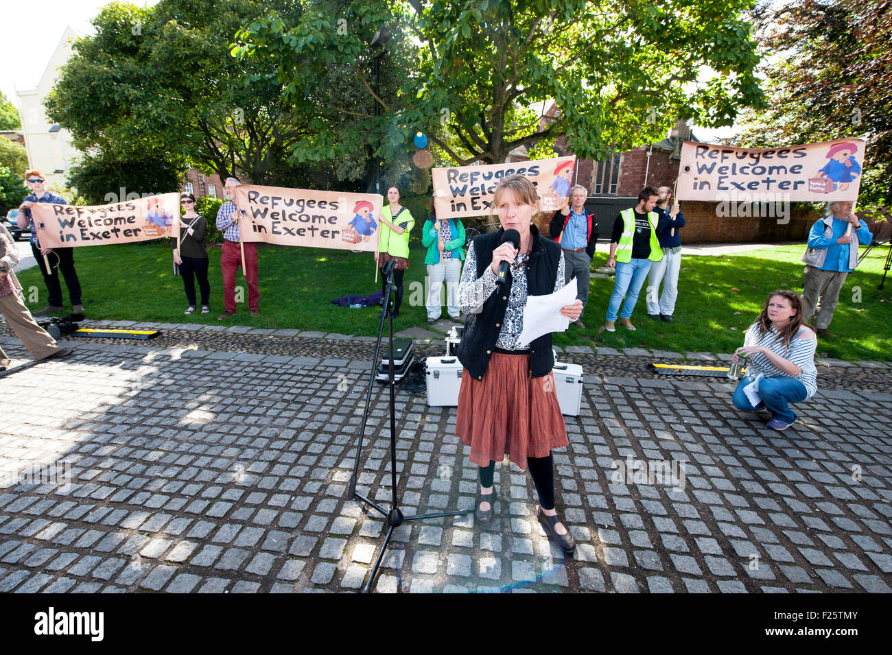 Exeter, Devon, UK. 12th Sep, 2015. June Marshall, who is a trustee of Refugee Support Devon speaking during the Exeter Solidarity With Refugees Event outside the west front of Exeter Cathedral Credit:  Clive Chilvers/Alamy Live News Stock Photo