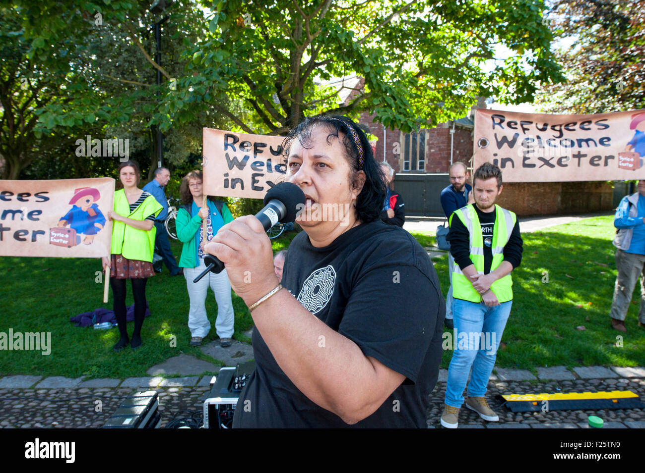 Exeter, Devon, UK. 12th Sep, 2015. Suaad George speaking during the Exeter Solidarity With Refugees Event outside the west front of Exeter Cathedral Credit:  Clive Chilvers/Alamy Live News Stock Photo