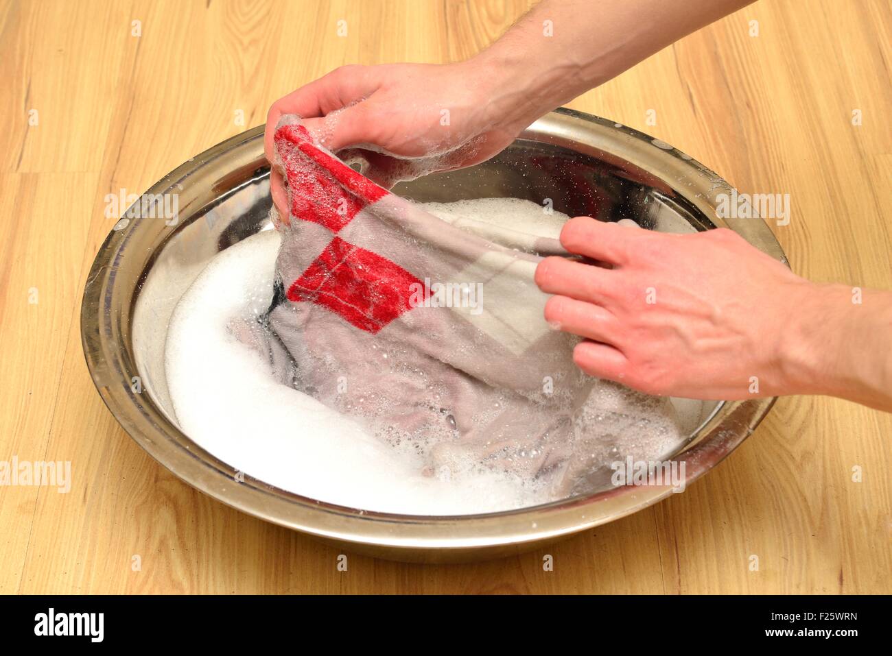 Hand wash sweaters with washing powder Stock Photo Alamy