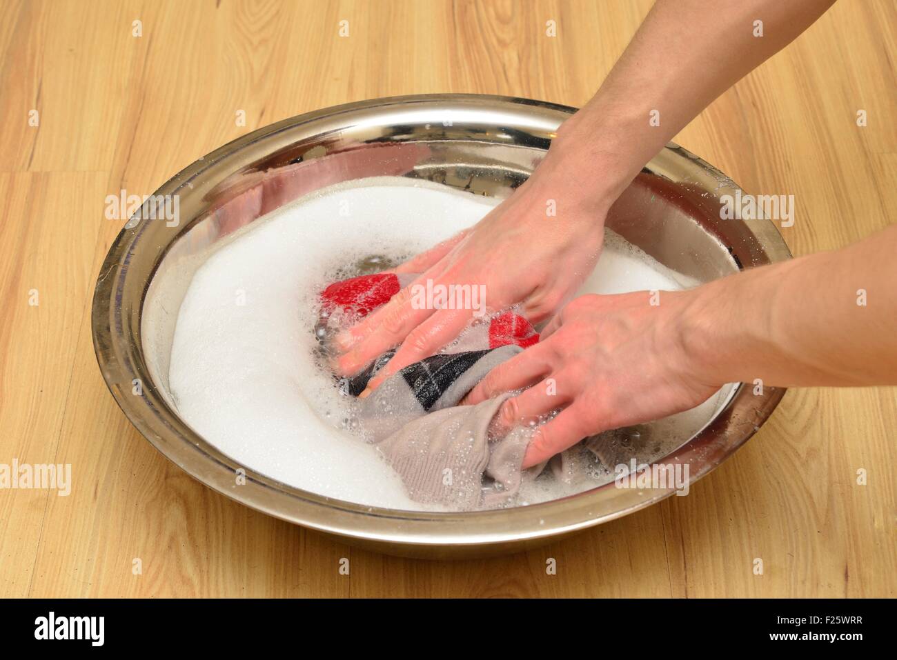 Hand wash sweaters with washing powder Stock Photo Alamy