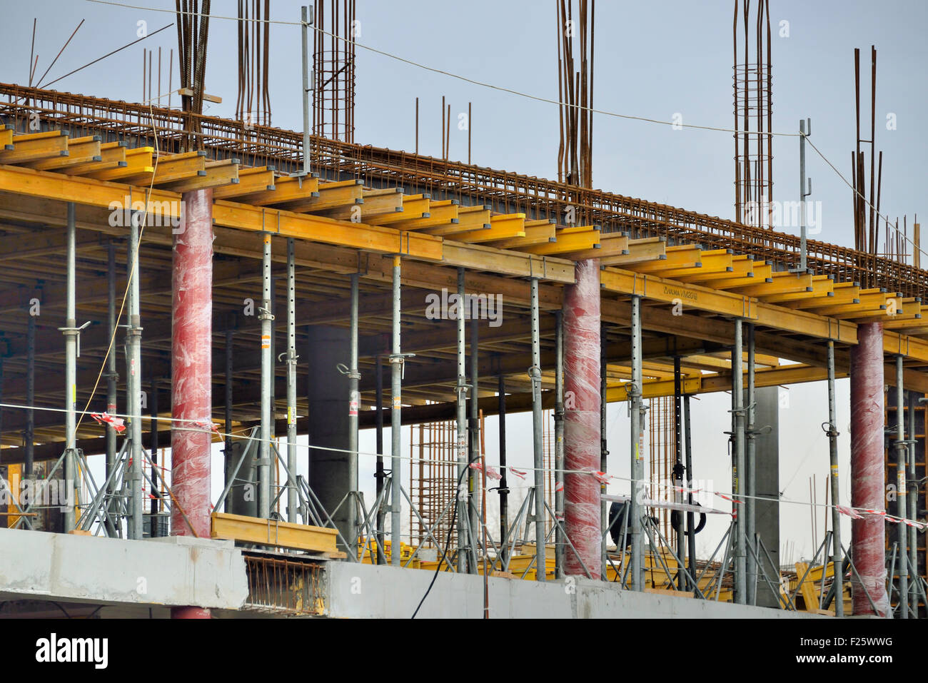 big yellow construction, building new skyscraper Stock Photo Alamy
