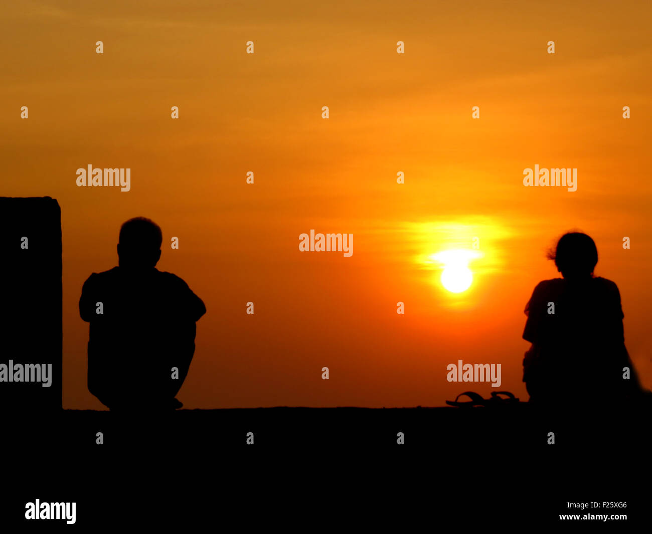 a-metaphorical-image-of-the-silhouettes-of-a-seperated-couple-on-the