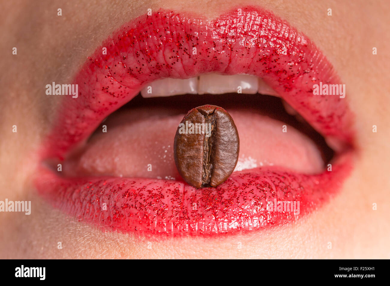 coffee beans between lips Stock Photo Alamy