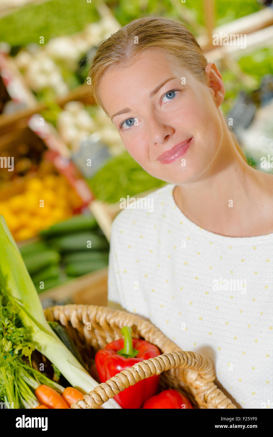 Lady with basket of vegetables Stock Photo - Alamy