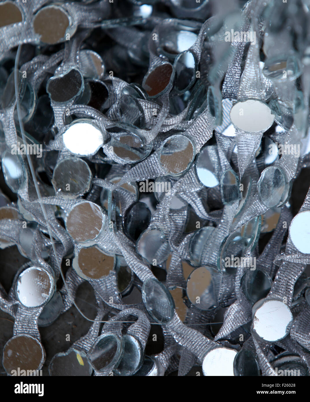 A background of a lace attached with mirrors used for decorations Stock Photo