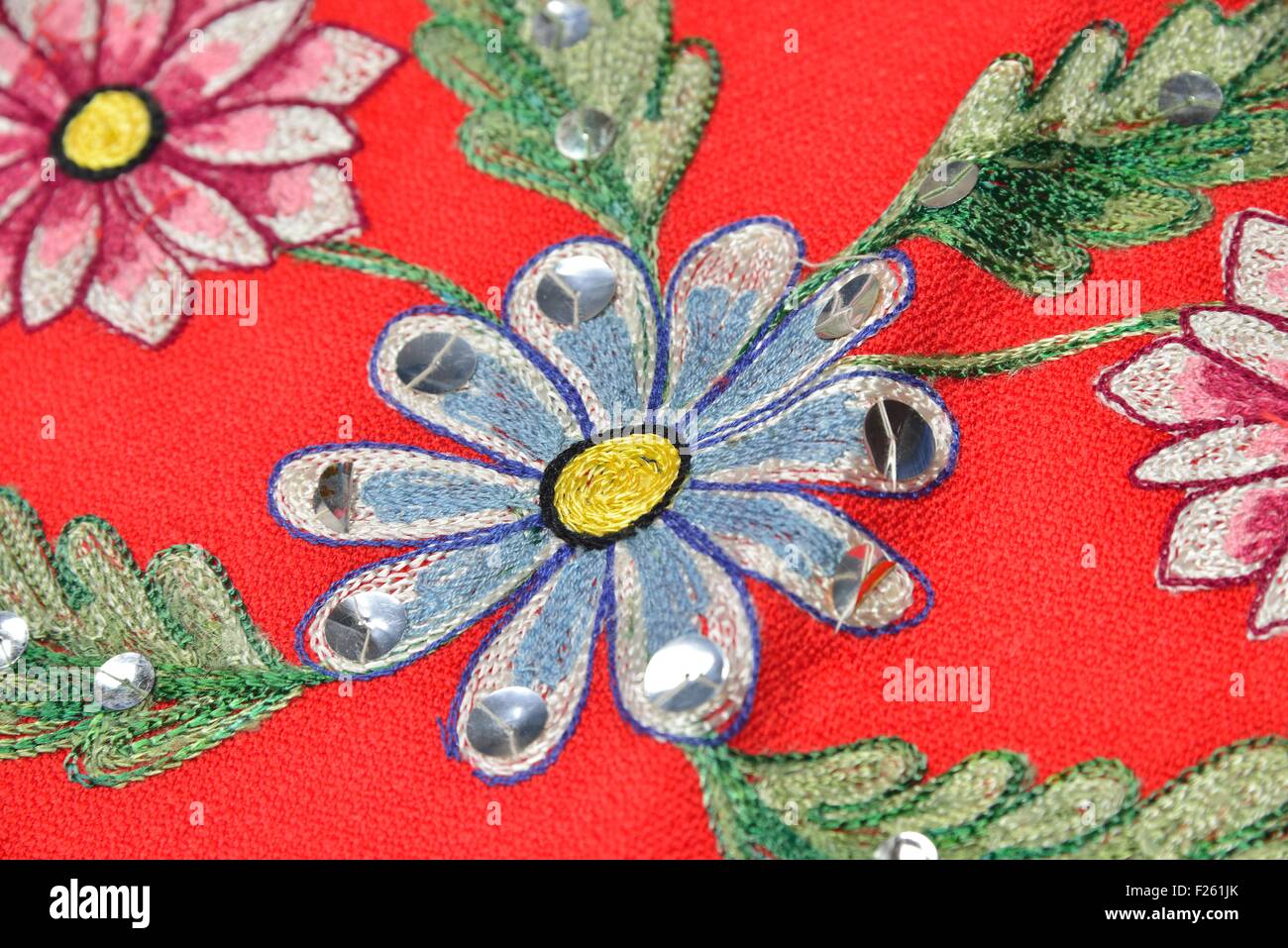 red material with flowers applique Stock Photo - Alamy