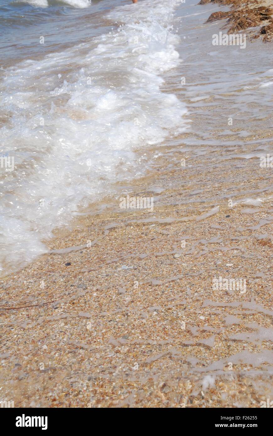 sea waves with foam on shore Stock Photo - Alamy