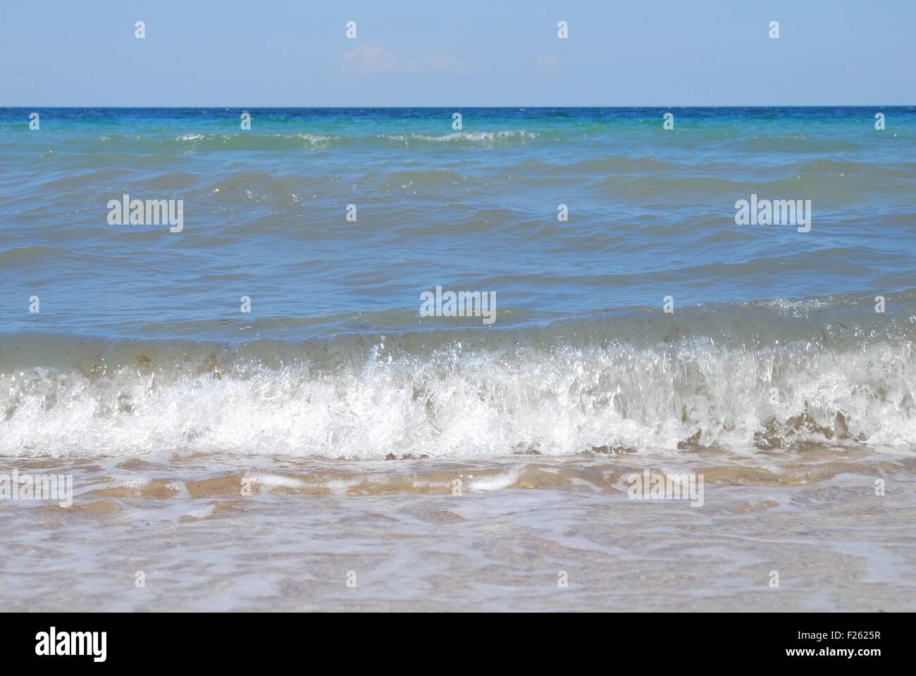 sea waves with foam on shore Stock Photo - Alamy