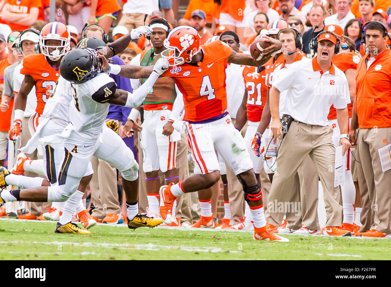 Clemson, South Carolina, USA. 12th Sep, 2015. Clemson Tigers quarterback Deshaun Watson (4) scrabbles for a first down before drawing a facemask penalty from Appalachian State Mountaineers defensive back Alex Gray (3) Saturday, Septermber 12, 2015 in action during the NCAA Football game between Appalachian State Mountaineers and Clemson Tigers at Death Valley in Clemson, SC. David Grooms/CSM Credit:  Cal Sport Media/Alamy Live News Stock Photo