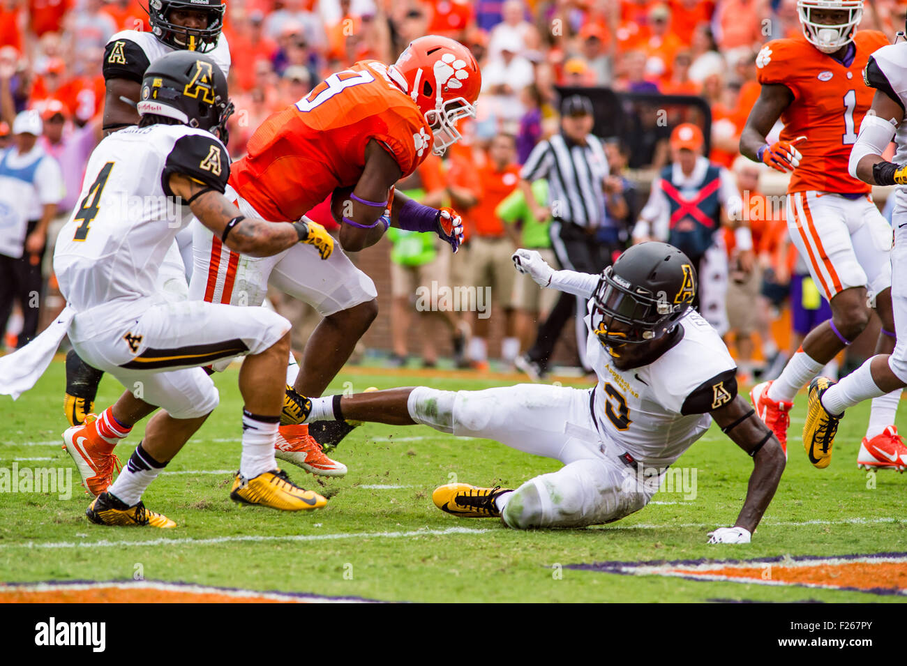 Clemson, South Carolina, USA. 12th Sep, 2015. Clemson Tigers running back Wayne Gallman (9) runs through Appalachian State Mountaineers defensive back Alex Gray (3) at the goal line to score a touchdown Saturday, September 12, 2015 in action during the NCAA Football game between Appalachian State Mountaineers and Clemson Tigers at Death Valley in Clemson, SC. David Grooms/CSM Credit:  Cal Sport Media/Alamy Live News Stock Photo