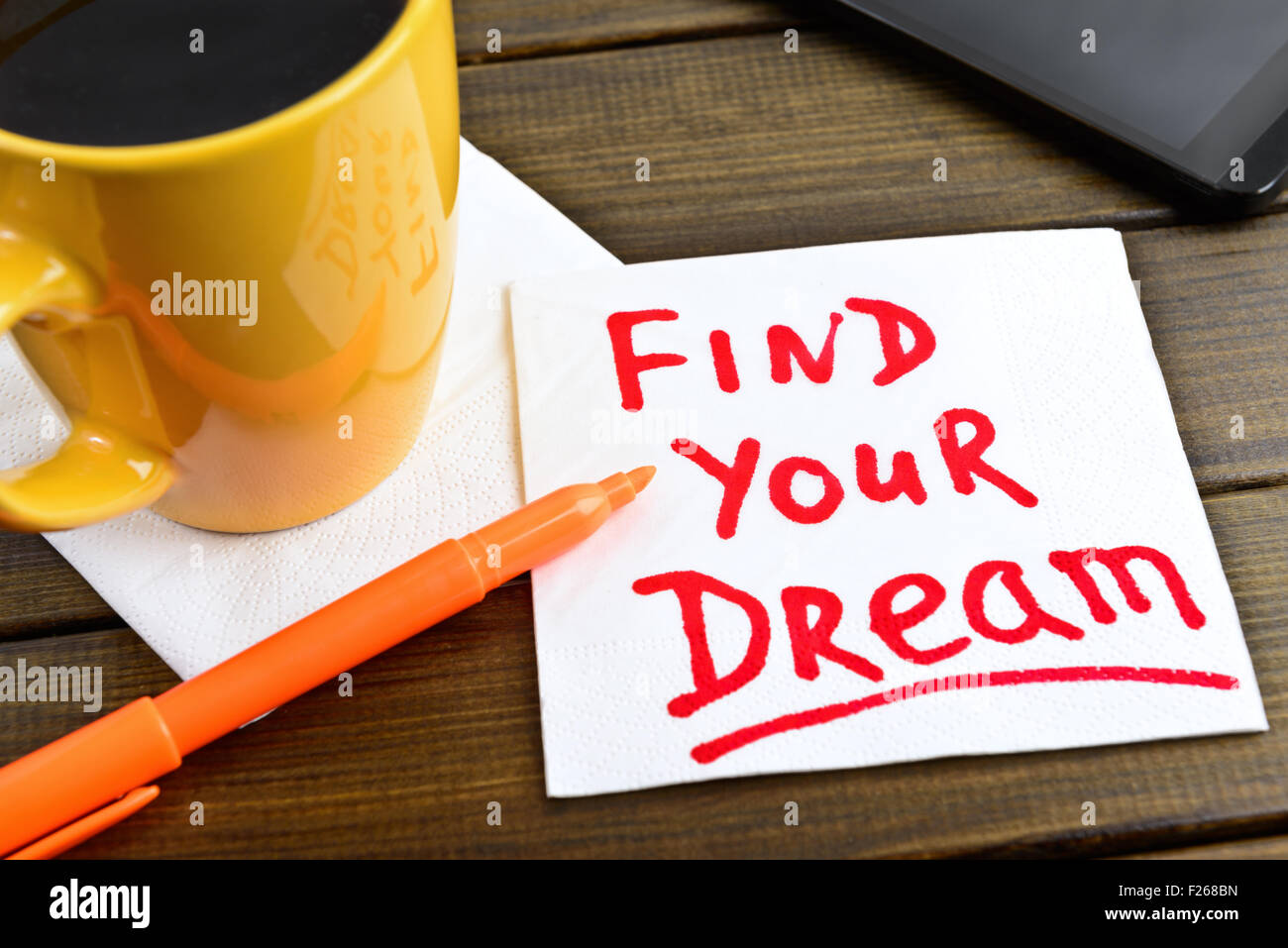 Find your dream - motivational handwriting on a napkin with a cup of coffee and phone Stock Photo