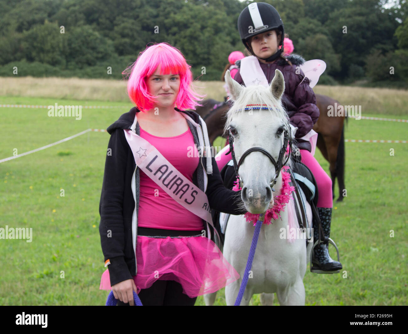 Basildon, Essex, UK. 12th September, 2015. Members of the horse riding community have turned out in force for fund raising mamorial ride to remember murdered sanctuary worker Laura Davies who worked at the Essex Horse and Pony Protection Society. Credit:  darren Attersley/Alamy Live News Stock Photo