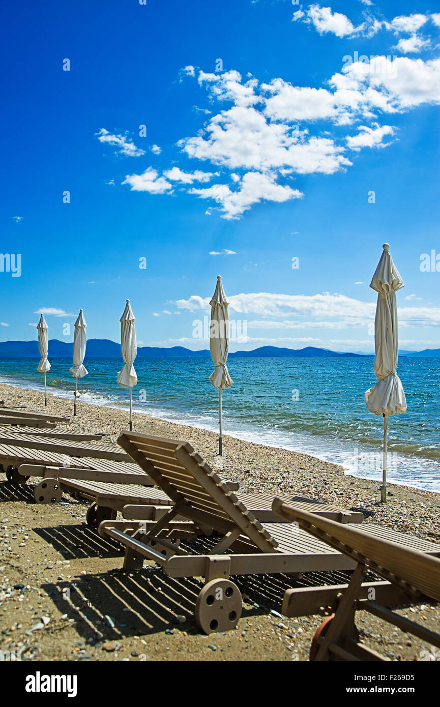 Beach with empty sunbeds on Pelion Peninsula, Thessaly, Greece Stock Photo