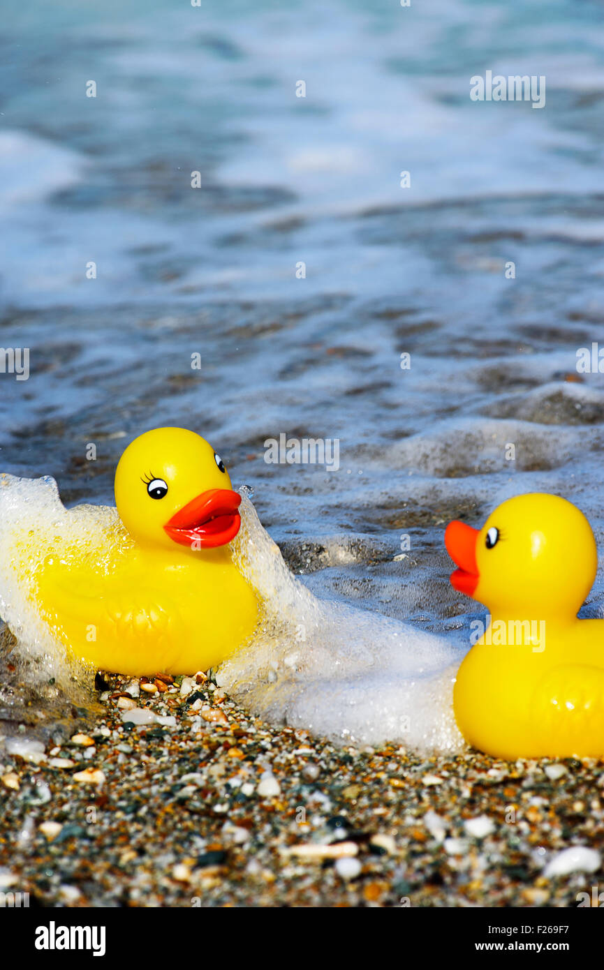 Two rubber ducks on Aegean beach Stock Photo