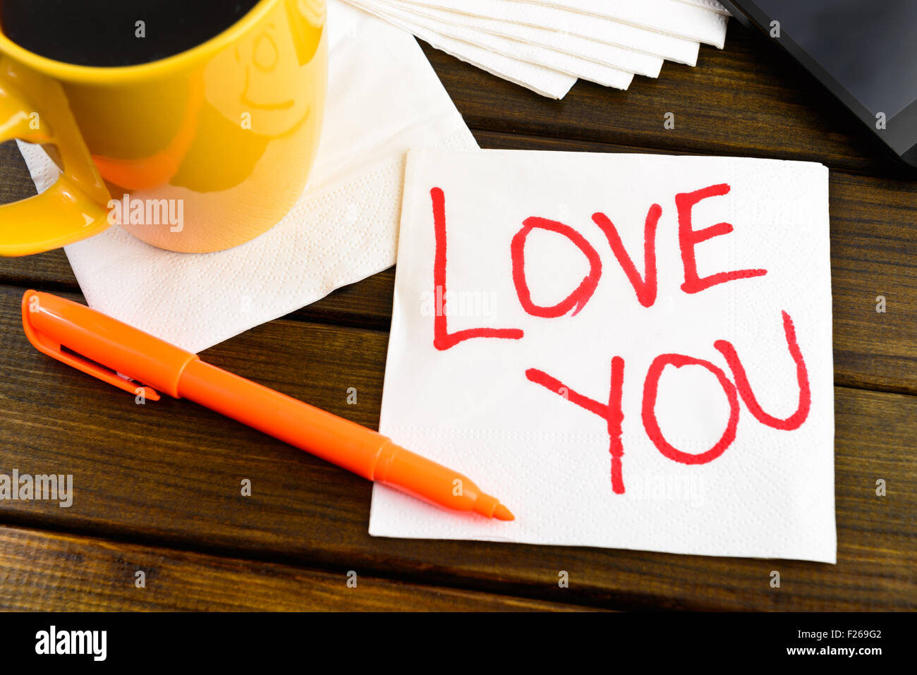 Love you -  handwriting on a napkin with a cup of coffee and phone Stock Photo