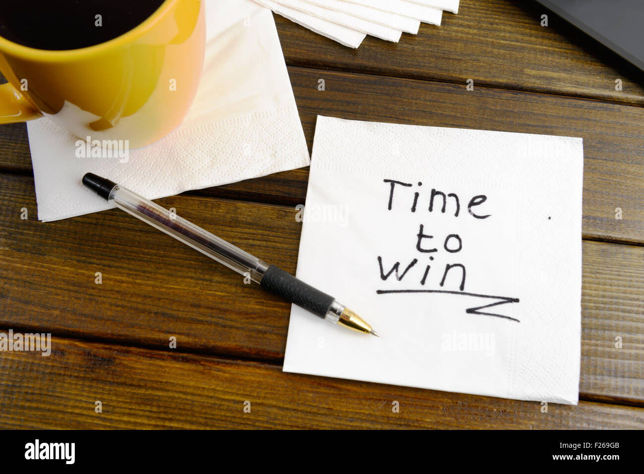 Time to win think positive -  handwriting on a napkin with a cup of coffee Stock Photo