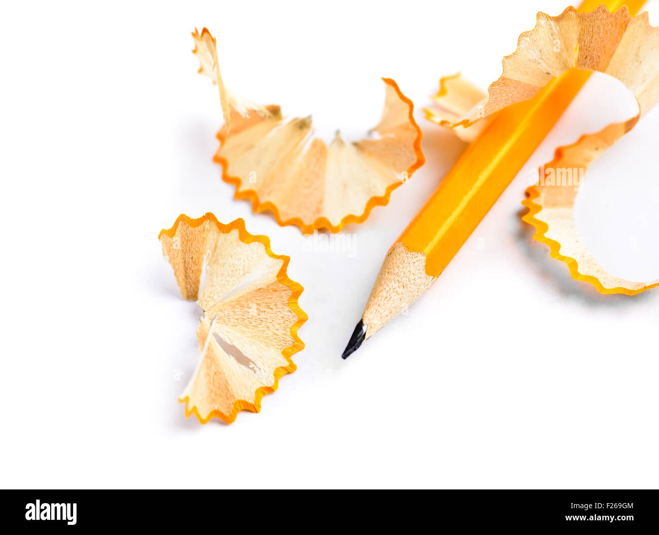Sharpened pencil and wood shavings isolated Stock Photo