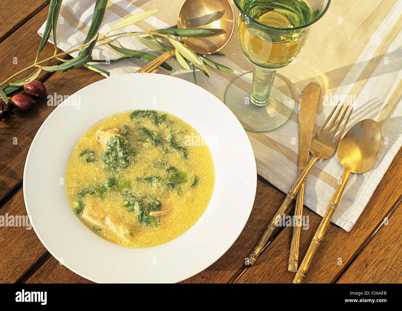 Avgolemono soup - typical Greek soup with chicken, spinach, eggs and lemon Stock Photo