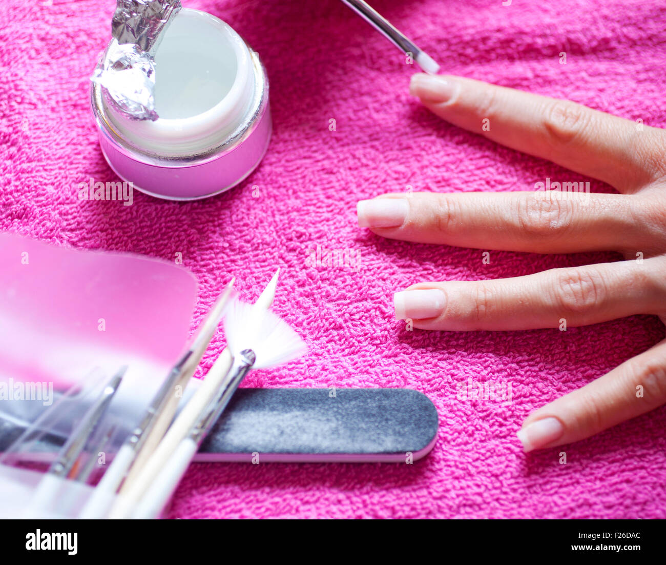 A Woman painting her nails Stock Photo Alamy