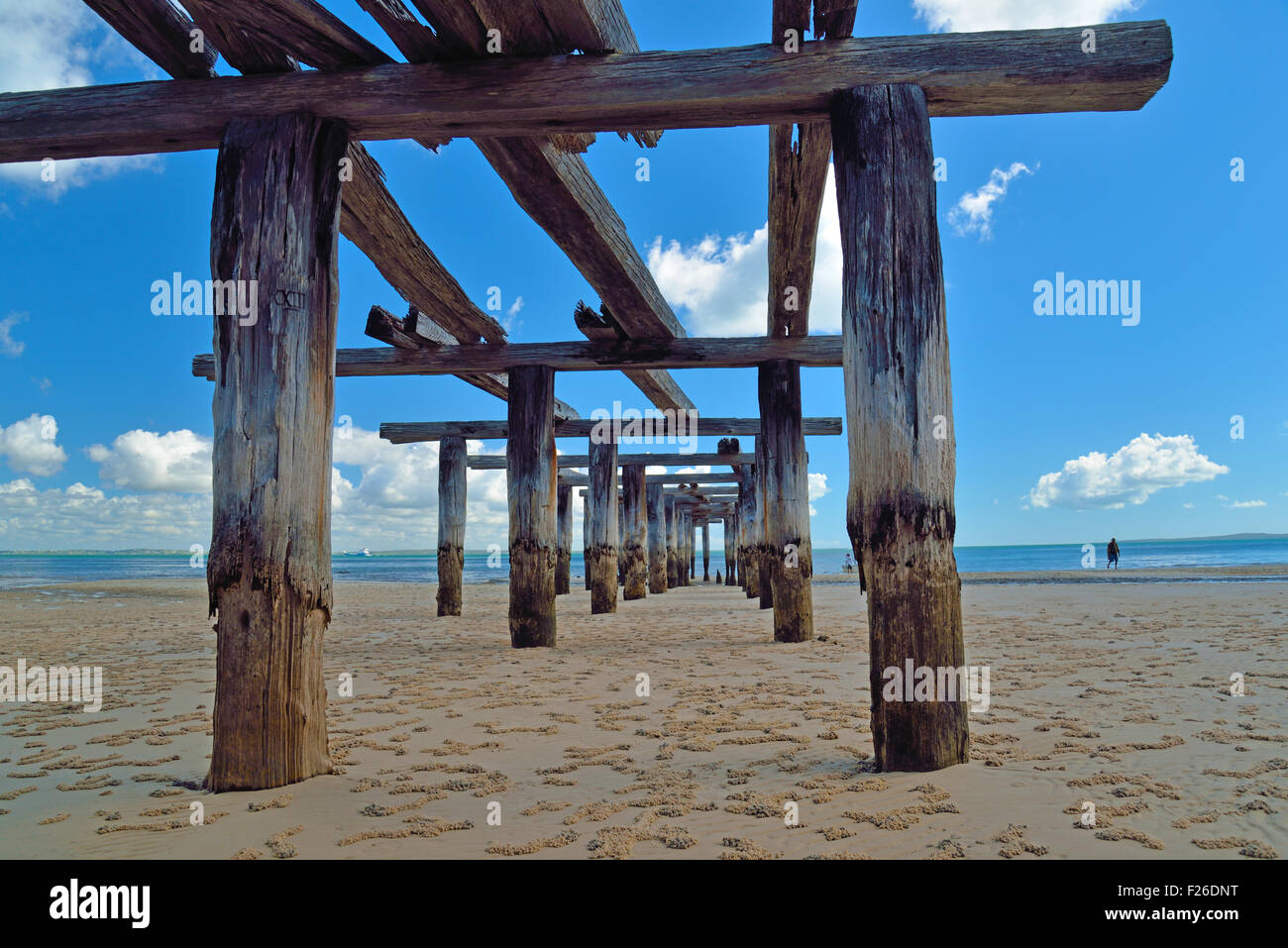 Old pier at Fraser Island beach in Australia Stock Photo