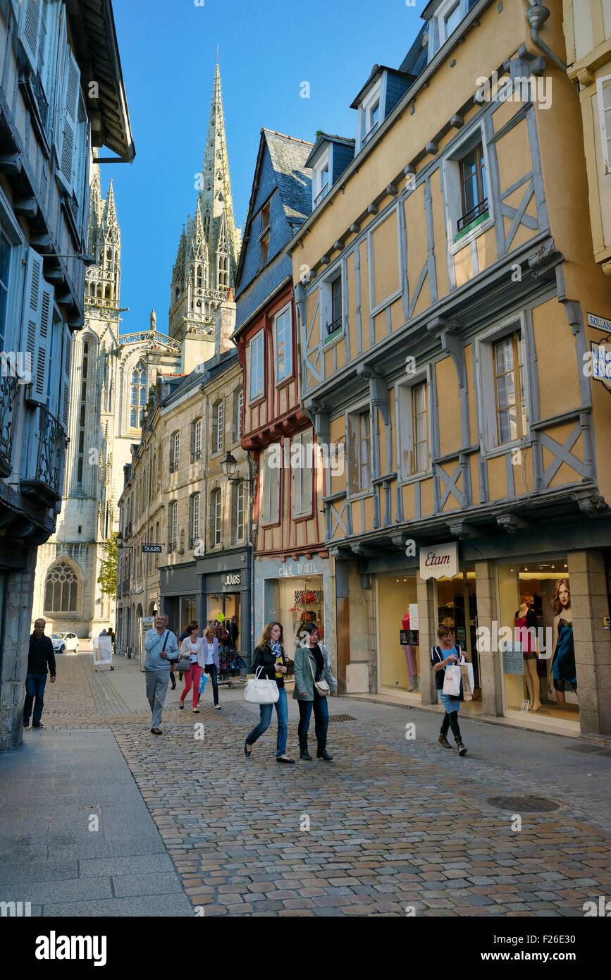 Cathedral of Saint Corentin seen beyond shops on Rue Kereon in the mediaeval city centre of Quimper, Finistere, Brittany, France Stock Photo