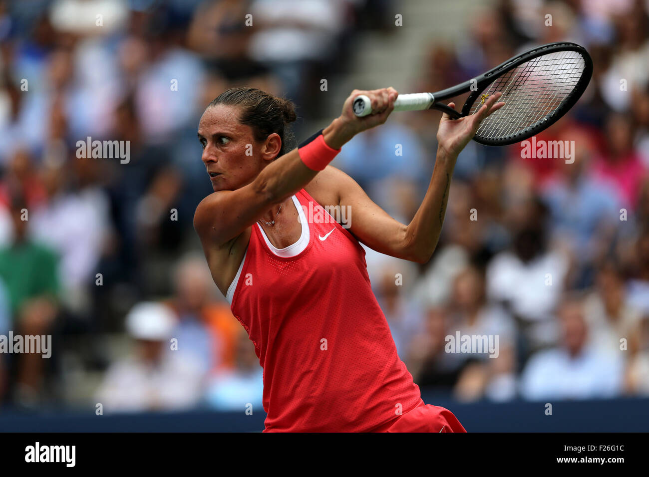 New York, USA. 12th Sep, 2015. Roberta Vinci of Italy returns a backhand to countrywoman Flavia Penetta during the women's final of the U.S. Open at Flushing Meadows, New York on the afternoon of September 12th, 2015.  Pennetta won the match 7-6 (7-4), 6-2 Credit:  Adam Stoltman/Alamy Live News Stock Photo
