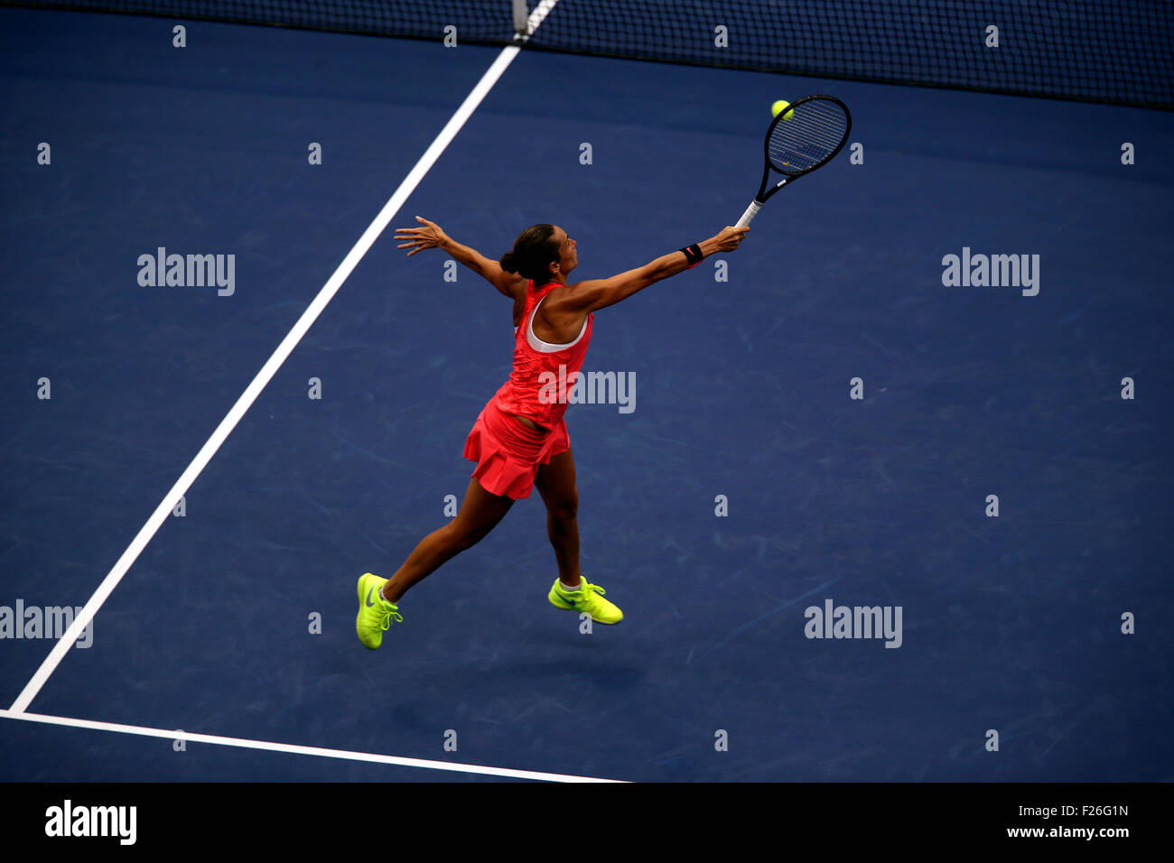 New York, USA. 12th Sep, 2015. Roberta Vinci of Italy reaches for a high volley to countrywoman Flavia Penetta during the women's final of the U.S. Open at Flushing Meadows, New York on the afternoon of September 12th, 2015.  Pennetta won the match 7-6 (7-4), 6-2 Credit:  Adam Stoltman/Alamy Live News Stock Photo