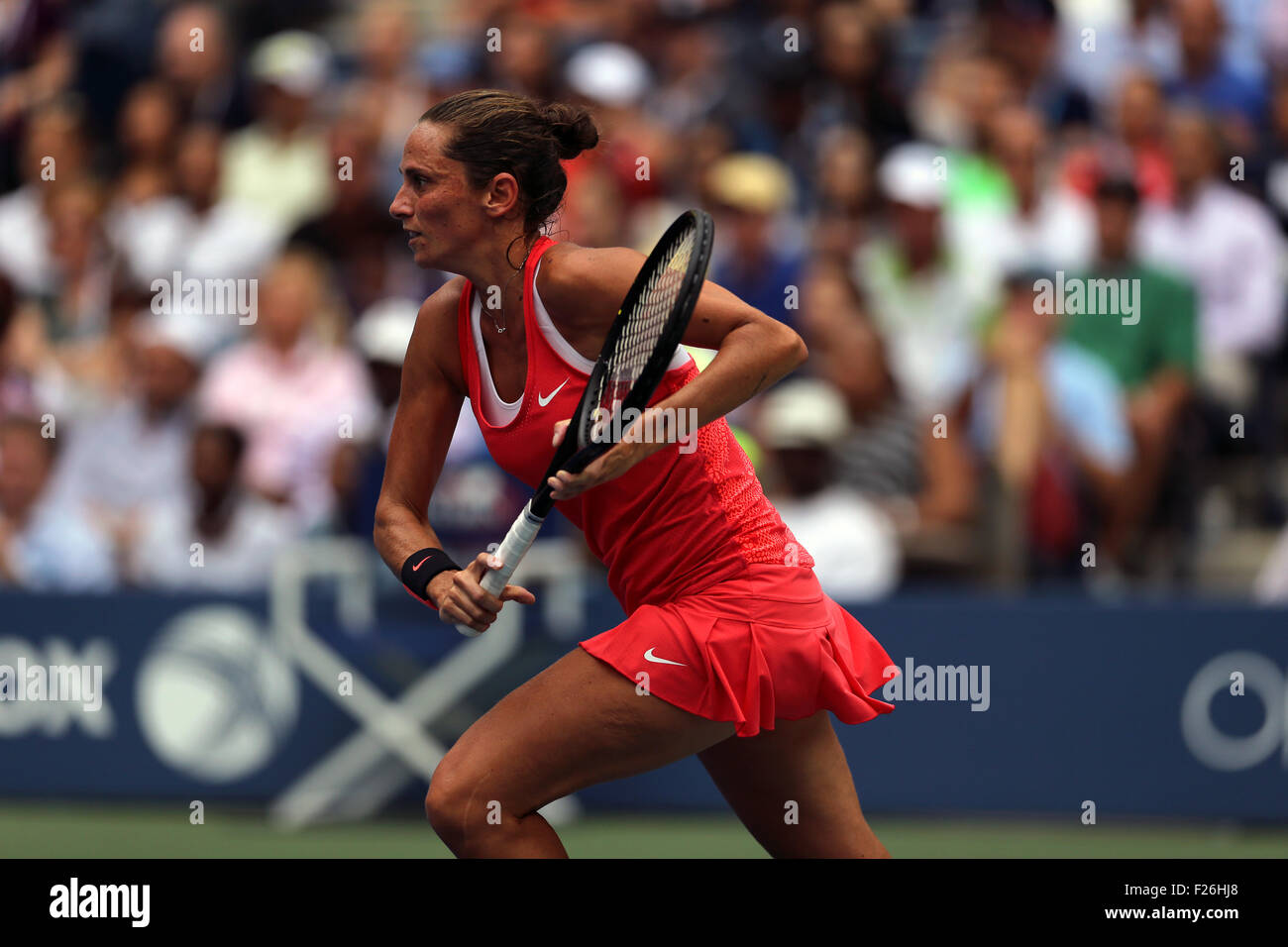 New York, USA. 12th Sep, 2015. Roberta Vinci of Italy moves towards the net against countrywoman Flavia Penetta during the women's final of the U.S. Open at Flushing Meadows, New York on the afternoon of September 12th, 2015.  Pennetta won the match 7-6 (7-4), 6-2 Credit:  Adam Stoltman/Alamy Live News Stock Photo