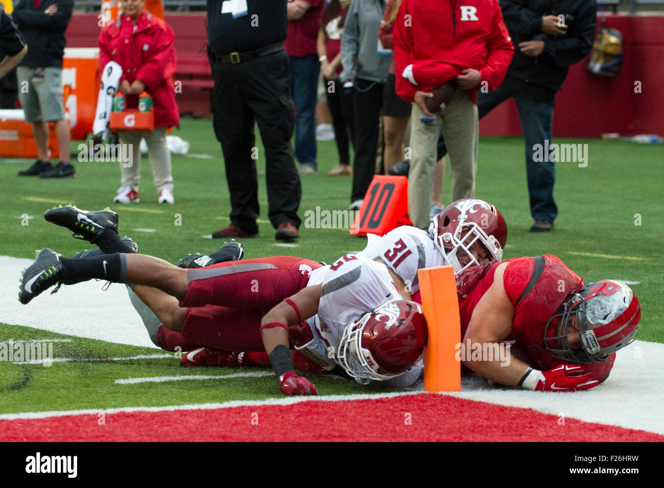 September 12, 2015: Rutgers Scarlet Knights fullback Sam Bergen (44) misses the pylon as he is tackled by Washington State Cougars cornerback Darrien Molton (22) and Washington State Cougars safety Isaac Dotson (31) during the game between Washington State Cougars and Rutgers Scarlet Knights at Highpoint Solutions Stadium in Piscataway, NJ. The Washington State Cougars defeat The Rutgers Scarlet Knights 37-34. Mandatory Credit: Kostas Lymperopoulos/CSM, Stock Photo