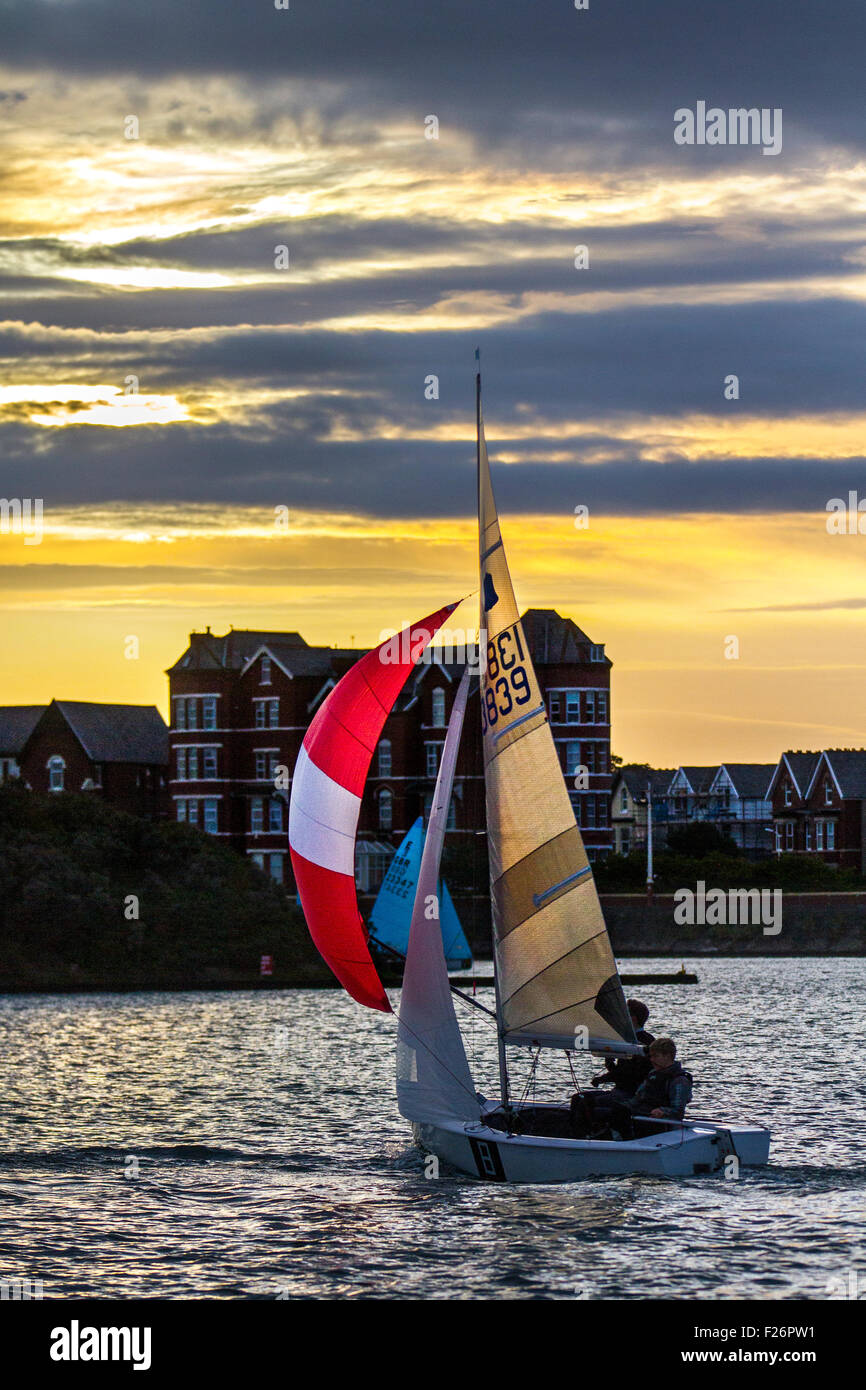 Southport, Merseyside, UK. 13th September, 2015. The Southport 24 Hour yachting Race is a national sailing endurance event for two-handed sailing dinghies, with 63 Firefly, Lark, Enterprise and GP 14 boats competing. The race, hosted by the West Lancs Yacht Club, has a long history and is usually held in September. The race starts at 12 noon on the Saturday. The contestants then race their dinghies around the marine lake finishing at noon today.  During the hours of darkness, the helm and crew of each dinghy must keep a careful watch for other boats (often capsized). Stock Photo