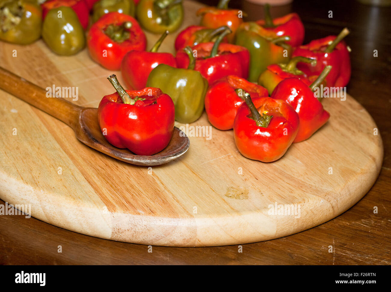 Red hot chili peppers on cutting board Stock Photo - Alamy