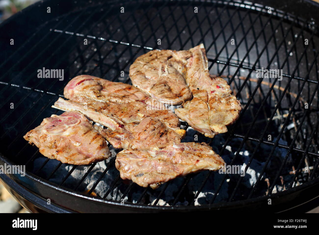 Grilling marinated lamb chops on a barbecue Stock Photo Alamy
