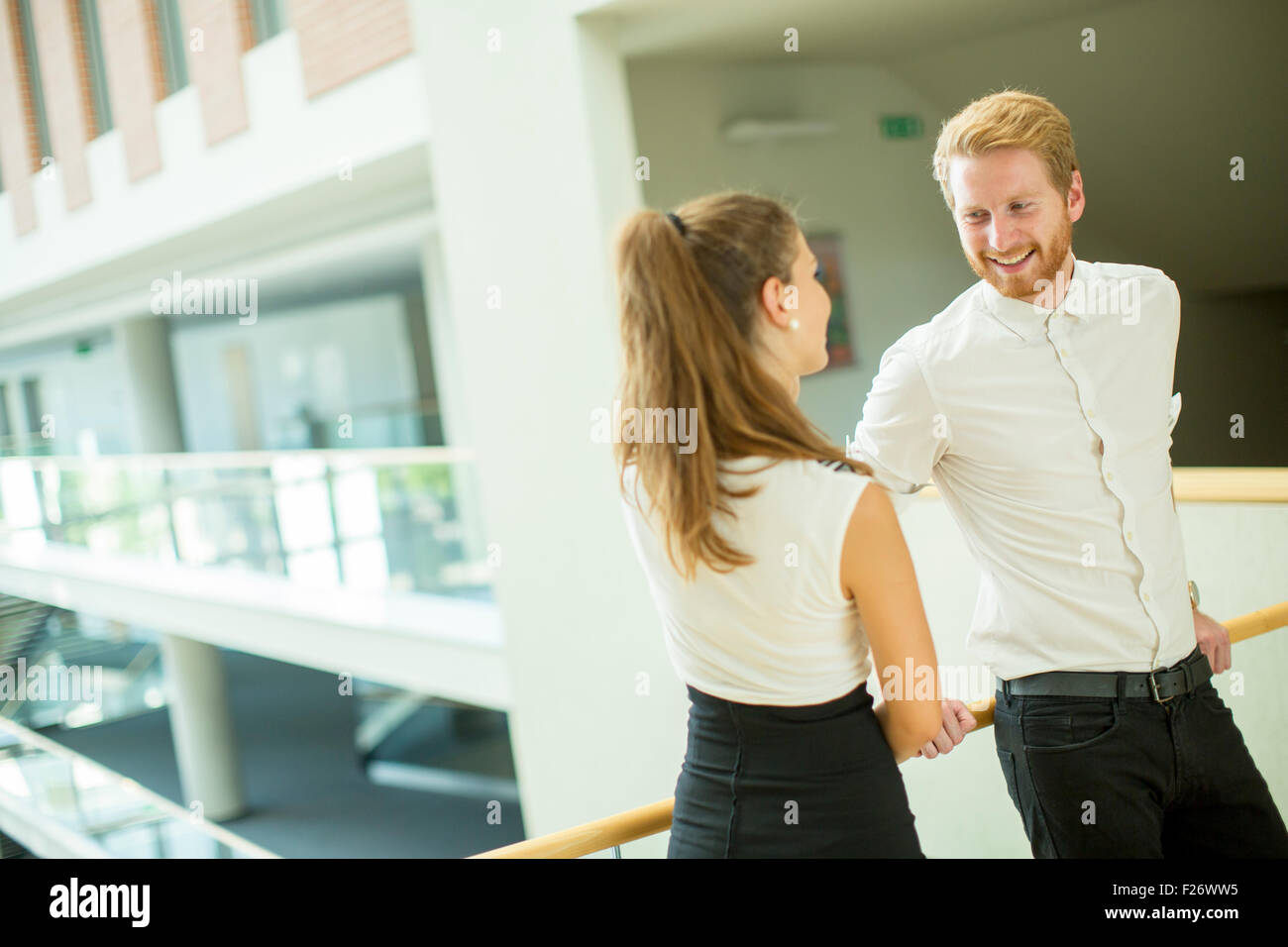 Young business couple in the hallway Stock Photo