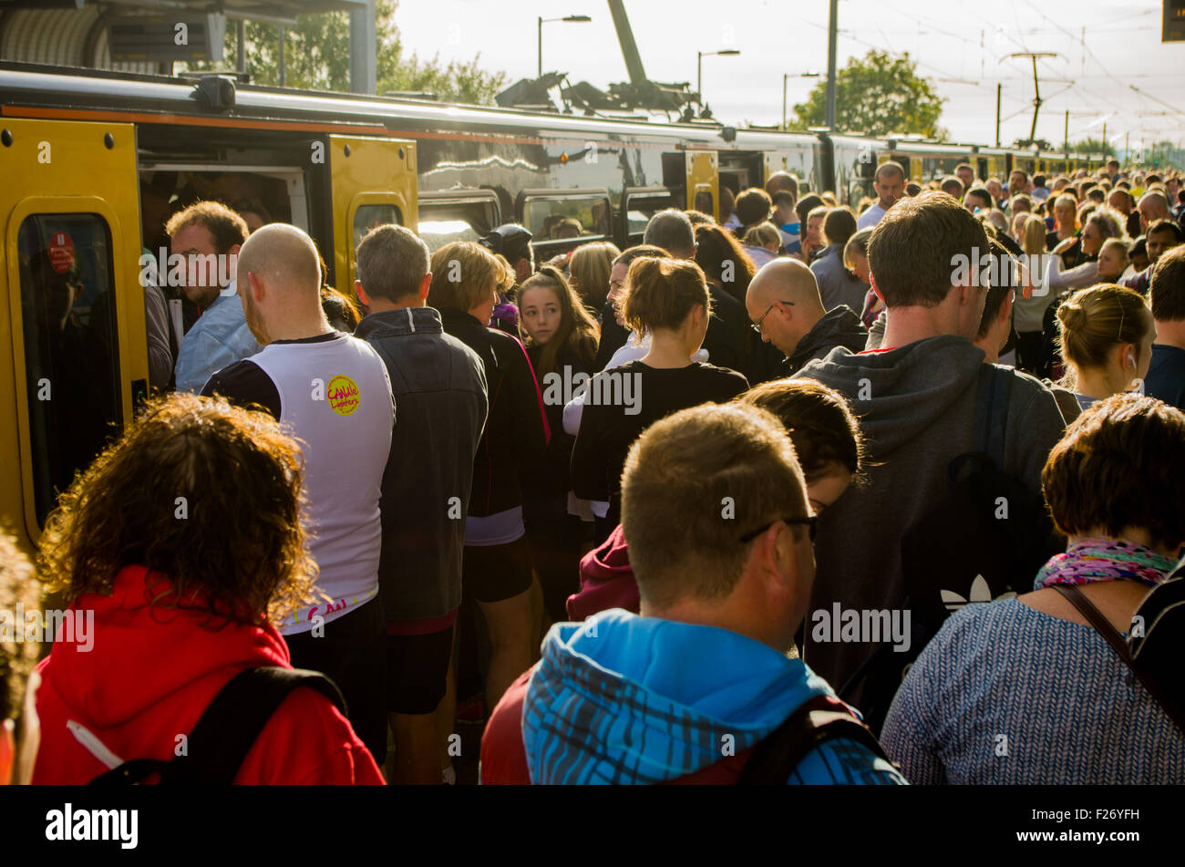 Great North Run competitors attempt to board trains at East Boldon Metro Station, Tyne & Wear, UK on 13th September 2015 Stock Photo