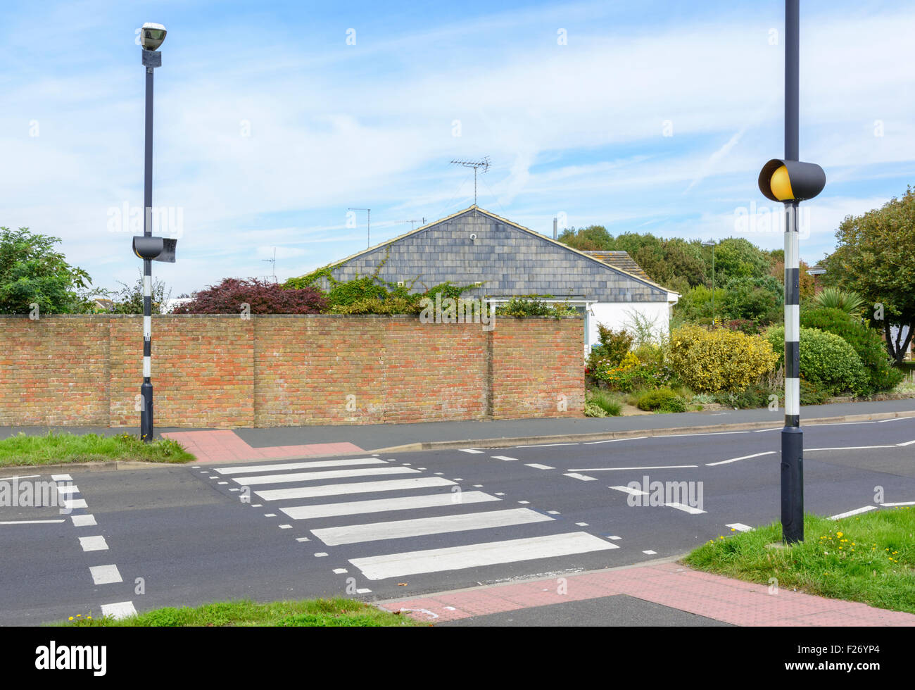 Zebra crossing across a road in West Sussex, England, UK. Stock Photo