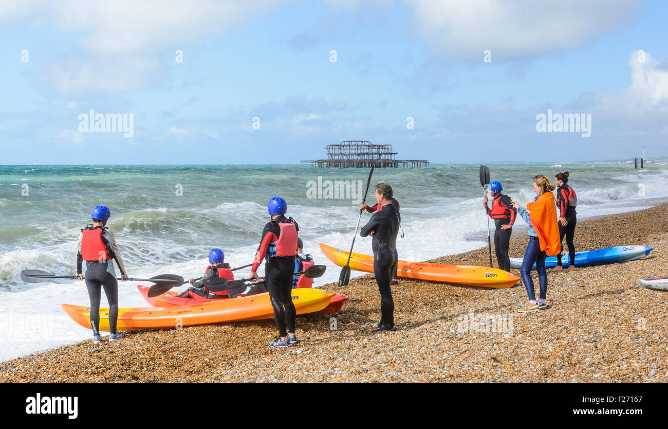 Group of Kayakers on the beach at the seafront. Stock Photo