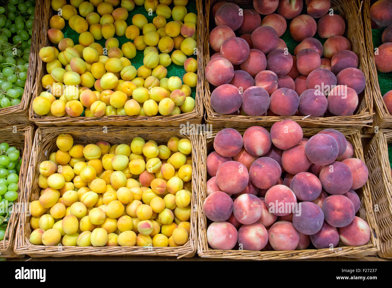 Yellow plums and red peaches at a market Stock Photo Alamy